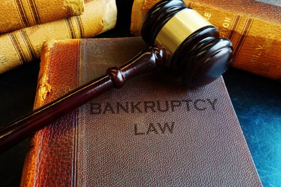 Gavel on bankruptcy Law books stock photo.
