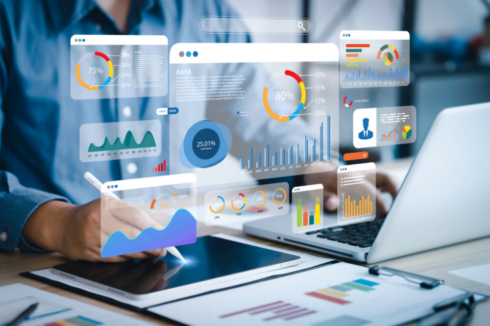 An analyst uses a computer and dashboard for data business analysis and Data Management System with KPI and metrics connected to the database for technology finance, operations, sales, marketing stock photo